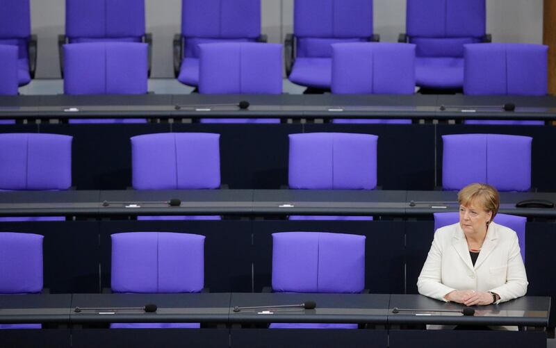 BERLIN, GERMANY - MARCH 14:  German Chancellor Angela Merkel sits down after taking her oath to serve her fourth term as chancellor following her election by the Bundestag on March 14, 2018 in Berlin, Germany. Members of the new German government, a coalition between Christian Democrats (CDU/CSU) and Social Democrats (SPD), were sworn in today and will begin work immediately. The new government took the longest to create of any government in modern German history following elections last September that left the German Christian Democrats (CDU) as the strongest party but with too few votes in order to have a strong hand in determining the next coalition.  (Photo by Carsten Koall/Getty Images)