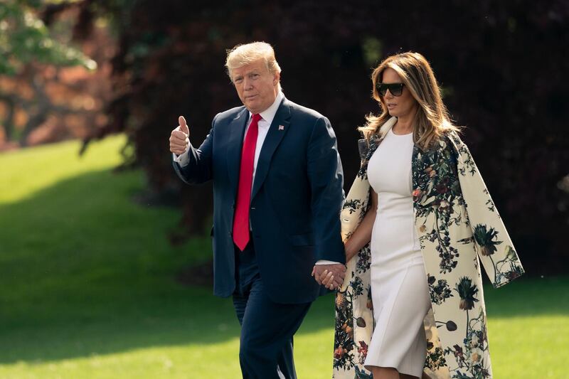 US President Donald Trump and first lady Melania walk to board Marine One for the short trip to Joint Base Andrews, then on to his estate in Palm Beach, Florida, Thursday, April 18, 2019. AP Photo