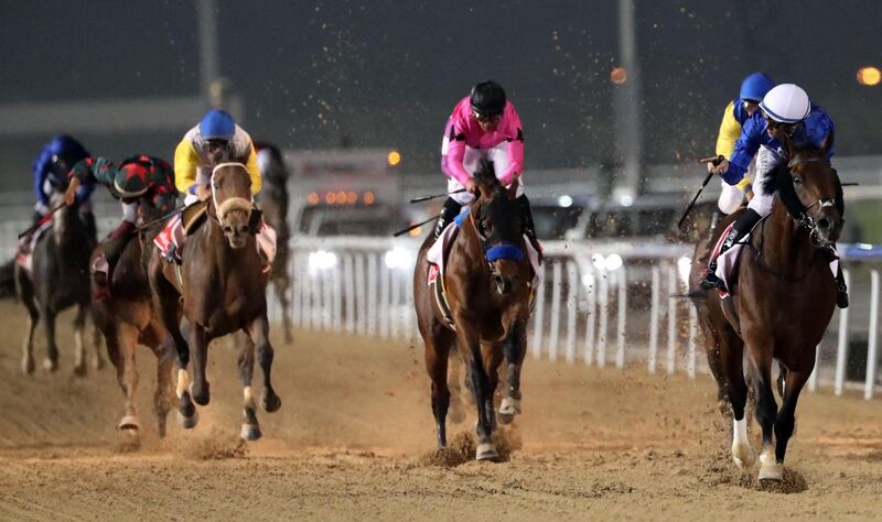 Jockey Christophe Soumillon rides Thunder Snow (R) across the finish line to win the Dubai World Cup horse race at the Dubai World Cup in the Meydan Racecourse on March 31, 2018 in Dubai. / AFP PHOTO / KARIM SAHIB