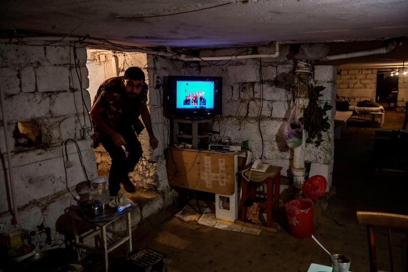 A man enters a basement shelter in the city of Stepanakert during the ongoing fighting between Armenian and Azerbaijani forces. AFP