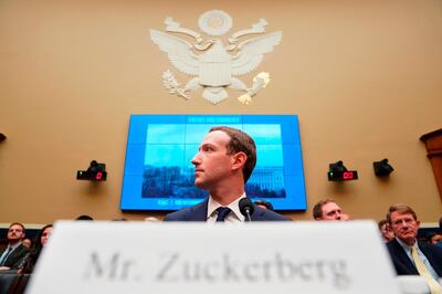 FILE - In this April 11, 2018, file photo, Facebook CEO Mark Zuckerberg testifies before a House Energy and Commerce hearing on Capitol Hill in Washington, about the use of Facebook data to target American voters in the 2016 election and data privacy. Federal regulators asked Wednesday, Dec. 9, 2020, for Facebook to be ordered to divest its Instagram and WhatsApp messaging services as the U.S. government and 48 states and districts accused the company of abusing its market power in social networking to crush smaller competitors. The antitrust lawsuits were announced by the Federal Trade Commission and New York Attorney General Letitia James. (AP Photo/Andrew Harnik, File)