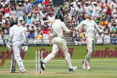 South African bowler Duanne Olivier celebrates the wicket of Pakistan's batsman Azar Ali on day one of the second cricket test match between South Africa and Pakistan at Newlans Cricket Ground in Cape Town, South Africa, Thursday, Jan. 3, 2019. (AP Photo/Halden Krog)
