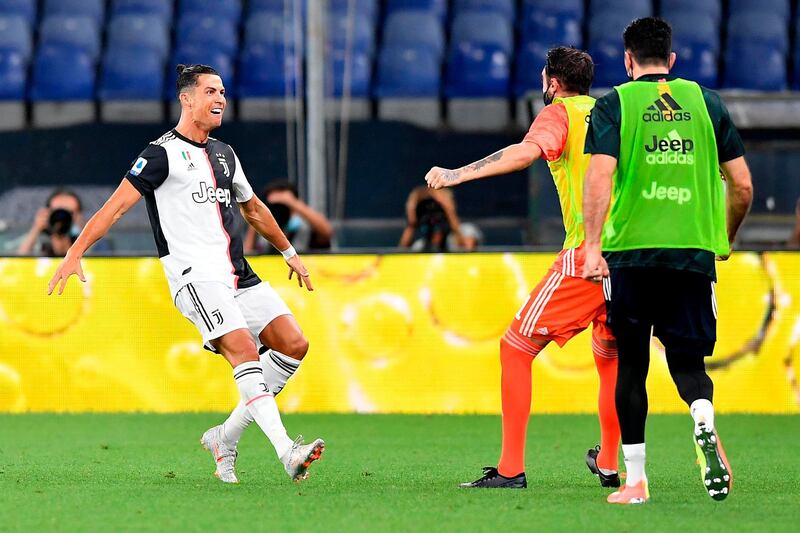 Cristiano Ronaldo, left, celebrates after scoring against Genoa. AP Photo