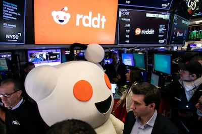 Snoo, mascot of Reddit, appears during the company's initial public offering at the New York Stock Exchange. Bloomberg