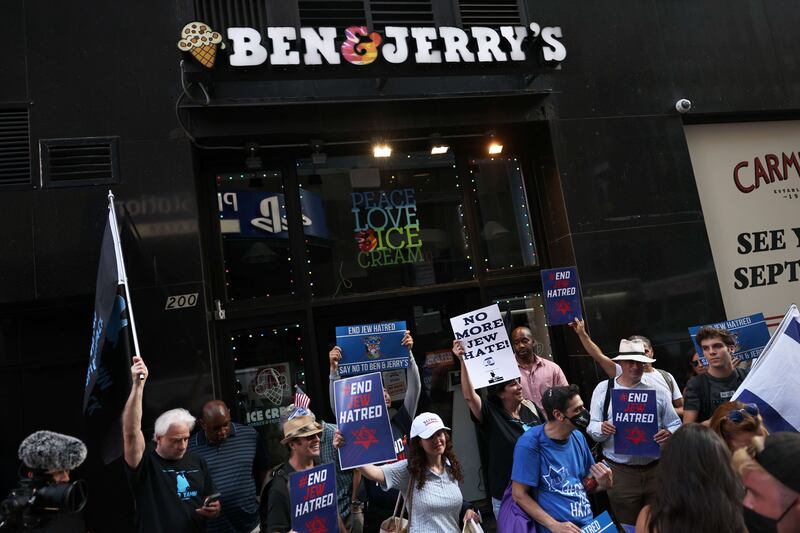 Protesters stand outside Ben & Jerry's Ice Cream at their Manhattan store earlier this month. AFP