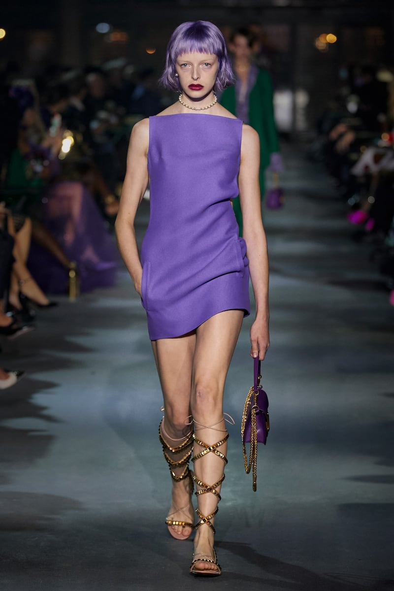 A mini dress worn with Roman sandals from the Valentino spring/summer 2022 show