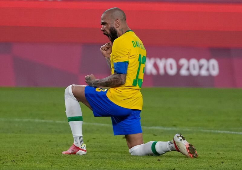 Dani Alves celebrates after scoring from the penalty spot against Mexico during the semi-final shootout at the Tokyo Olympics. AP