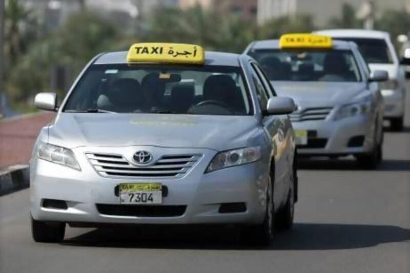 Abu Dhabi's taxi regulator, TransAd, has been tryng to phase out older cabs for the newer, silver ones shown here.