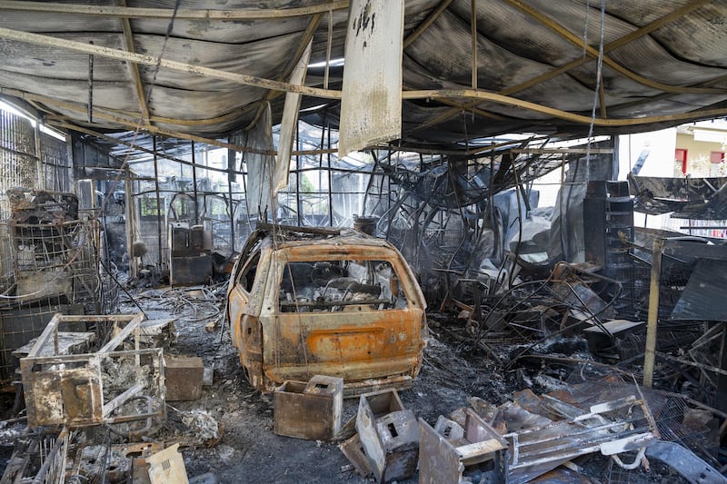 A torched house and car in the town of Oliveri in the province of Messina, Sicily, after an overnight fire raged across the distric. tAFP