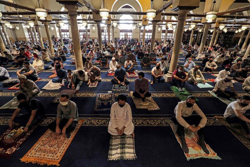 Worshippers perform Friday prayers inside Cairo's Al Azhar mosque. AFP