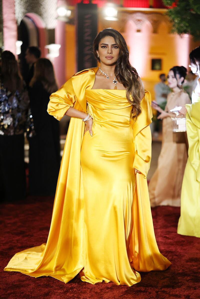 Chopra in a bright yellow satin gown by Lebanese designer Nicolas Jebran. Getty Images