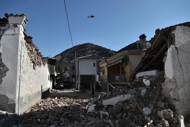 An army helicopter flies over collapsed buildings in the village of Damasi. According to the Athens observatory, the epicentre of the quake was 21 kilometres south of the town of Elassona, near Larissa. AFP