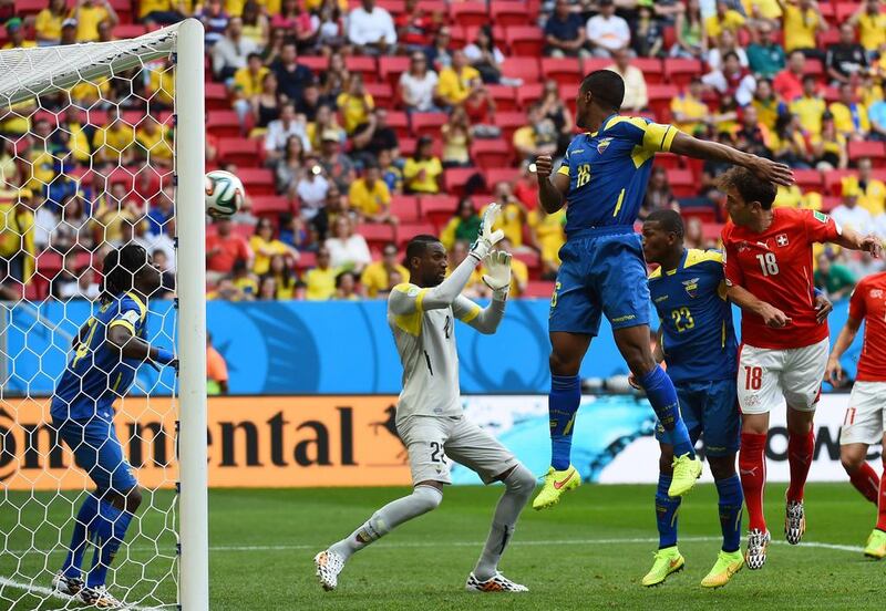 Switzerland forward Admir Mehmedi, right, scores the equaliser against Ecuador from a header on Sunday in their 2014 World Cup Group E match in Brasilia, Brazil. Anne-Christine Poujoulat / AFP
