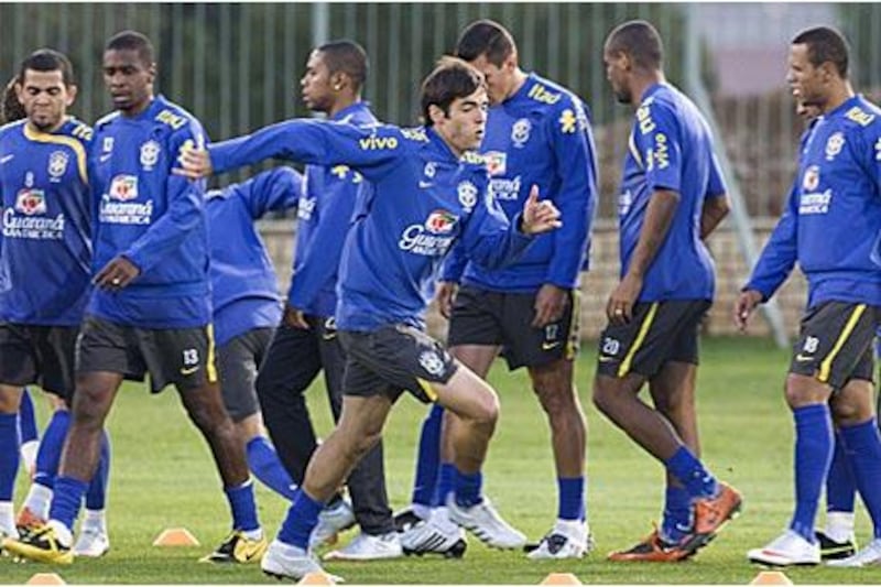 Real Madrid's new playmaker Kaka, foreground, goes through a training routine with his Brazil teammates in Bloemfontein.