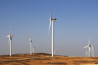 Turbines are seen at the Tafila wind farm in southern Jordan. Masdar on Monday said it reached first financial close on the acquisition of eight renewable projects in the US from EDF Renewables North America. Salah Malkawi / The National