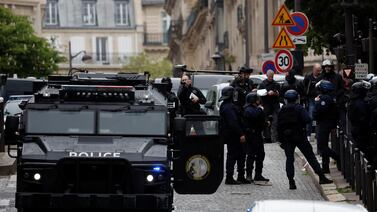 Police secure the area in Paris, near Iran's consulate, where a man is threatening to blow himself up. Reuters