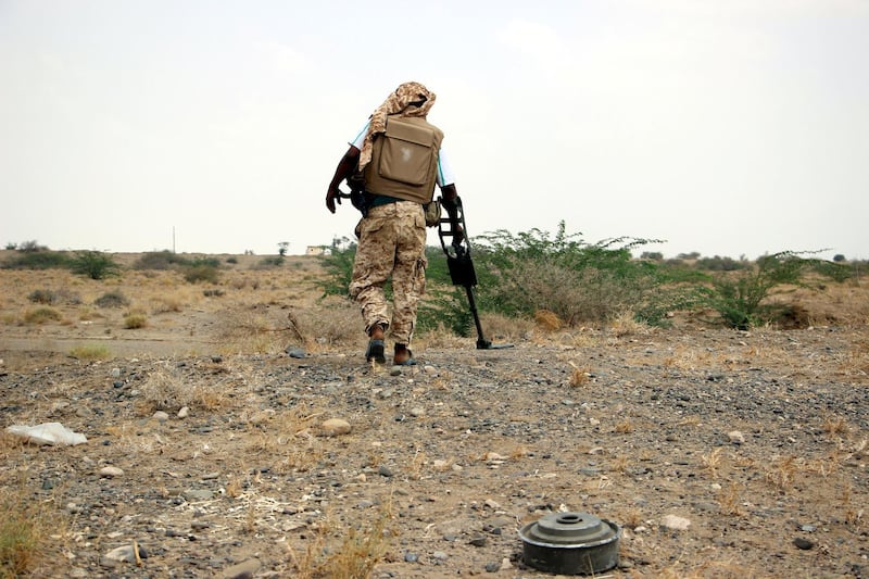 epa06612569 An Emirati forces-trained Yemeni deminer with a metal detector searches for landmines allegedly planted by the Houthi rebels at a town after seizing it from the rebels in the western province of Hodeidah, Yemen, 18 March 2018. According to reports, nearly 10 thousand people have been killed in Yemen since March 2015, when a Saudi-led military coalition intervened with the aim of pushing the Houthi rebels from Sana?a and other cities and restoring power to Yemen's internationally recognized government of President Abdo Rabbo Mansour Hadi.  EPA-EFE/STRINGER *** Local Caption *** 54206694