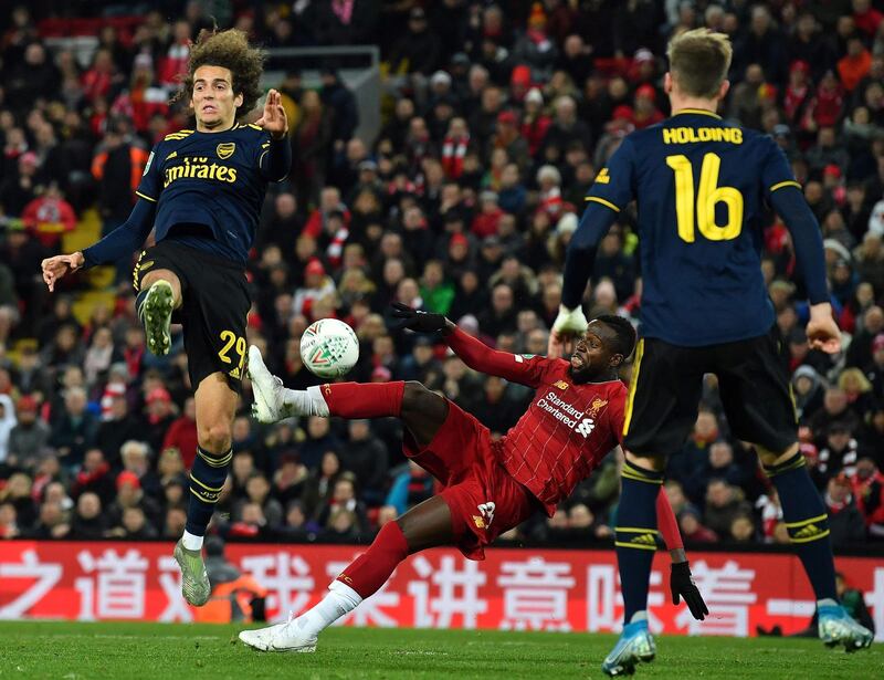 Liverpool striker Divock Origi, centre, scores his team's fifth goal. AFP
