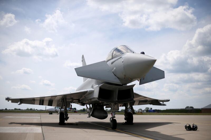 CONINGSBY, ENGLAND - MAY 21:  An RAF Eurofighter Typhoon is displayed during the unveiling of the commemorative D-Day Eurofighter Typhoon jet at RAF Coningsby on May 21, 2014 in Coningsby, England. This year commemorates the 70th anniversary of the D-Day landings on the 6th June. The attack saw more than 156,000 Allied troops storm the beaches of France and eventually led to the Allied liberation of France in 1944. (Photo by Stephen Pond/Getty Images)