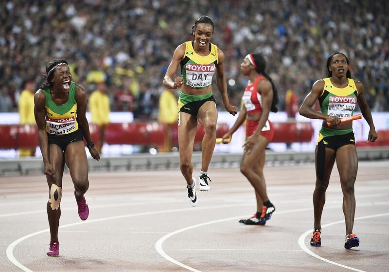Jamaica’s Shericka Jackson, left, Christine Day and Novlene Williams-Mills celebrate after their 400-metre relay victory on Sunday. Franck Robichon / EPA

