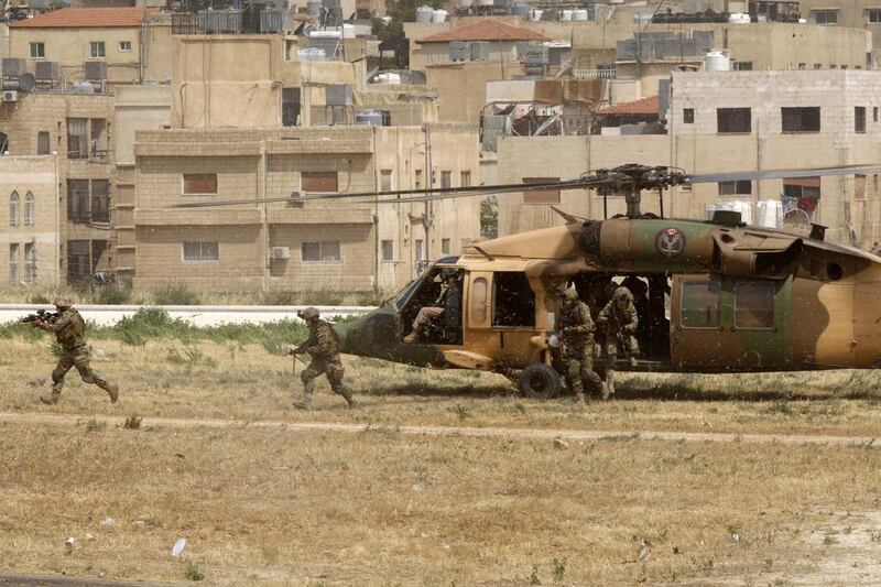 A Jordanian special operation unit demonstrates tactical displays for attacking terrorists and evacuating hostages during the opening ceremony of SOFEX 2016 on May 10, 2016 in Amman, Jordan. Salah Malkawi for The National