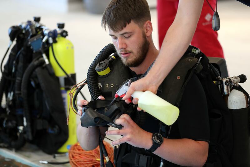 Royal Navy ship divers try out the new Deep Dive Dubai pool.