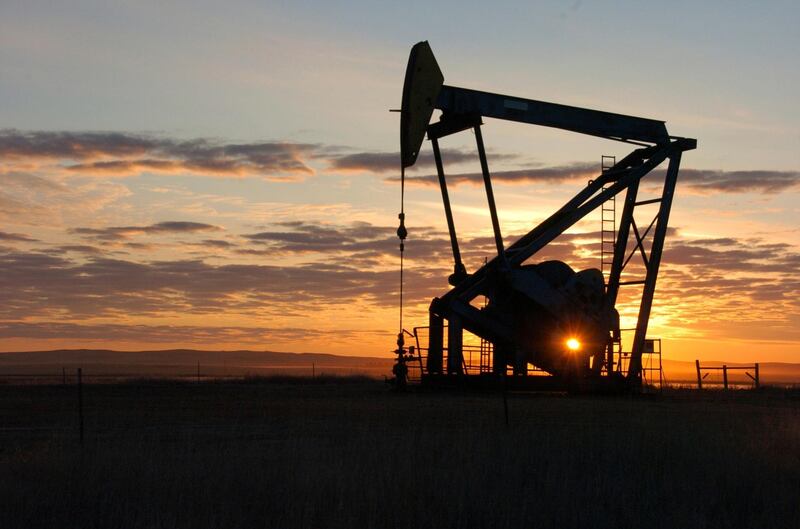 FILE - This Nov. 6, 2013 file photo shows a Whiting Petroleum Co. pump jack pulls crude oil from the Bakken region of the Northern Plains near Bainville, Mont. A federal judge has ruled that the Trump administration's leading steward of public lands has been serving unlawfully and blocked him from continuing in the position. U.S. District Judge Brian Morris said Friday, Sept. 25, 2020, that U.S. Bureau of Land Management acting director William Perry Pendley was never confirmed to the post by the U.S. Senate and served unlawfully for 424 days. Montana's Democratic governor had sued to remove Pendley, saying the the former oil industry attorney was illegally overseeing a government agency that manages almost a quarter-billion acres of land, primarily in the U.S. West. (AP Photo/Matthew Brown, File)