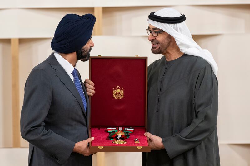 Sheikh Mohamed presents the First Class Order of Zayed II medal to Ajay Banga, president of the World Bank Group. Abdulla Al Neyadi / Presidential Court