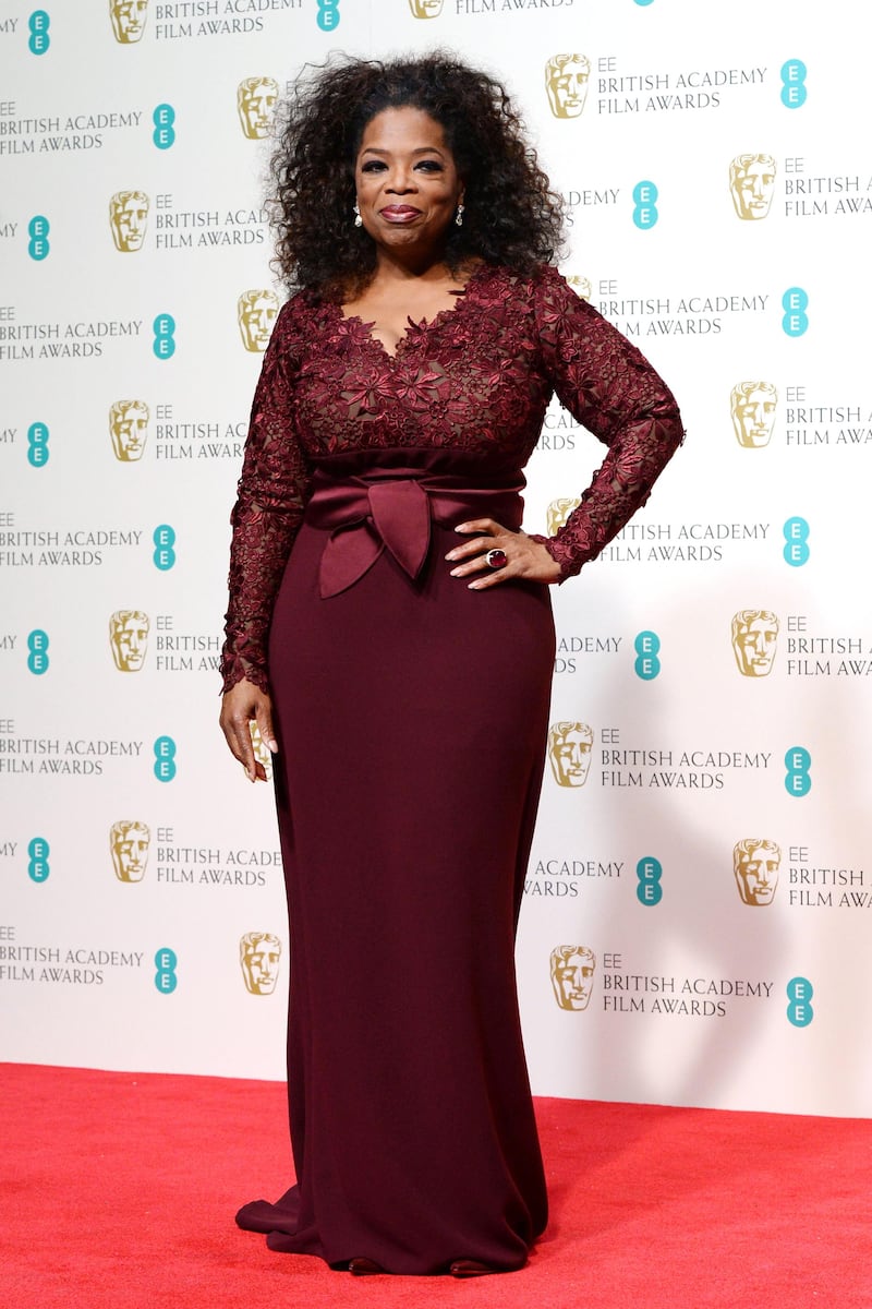 epa04082271 US TV host and actress Oprah Winfrey poses in the press room after presenting the Outstanding British film award at the 2014 EE British Academy Film Awards ceremony at The Royal Opera House in London, Britain, 16 February 2014. The ceremony is hosted by the British Academy of Film and Television Arts (BAFTA).  EPA/ANDY RAIN