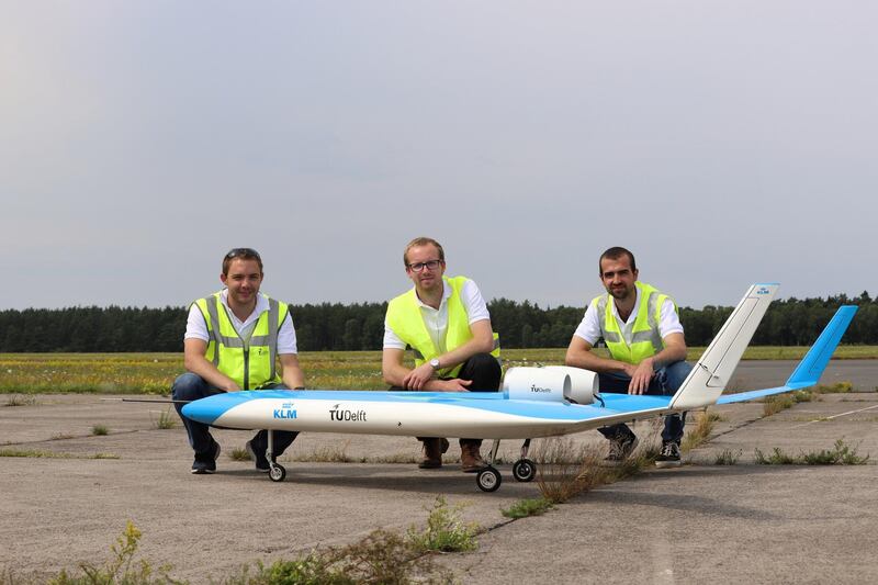 The flight crew with the scale model. Courtesy Malcolm Brown