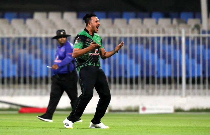 Umair Ali of Future Mattress celebrating after taking the wicket in the Sharjah Ramadan Cup final between Future Mattress vs MCM Cricket Club held at Sharjah International Cricket Stadium in Sharjah on May 7,2021. Pawan Singh / The National. Story by Paul