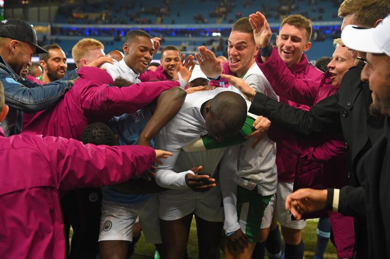 MANCHESTER, ENGLAND - MAY 09:  Yaya Toure of Manchester City gets a send off from his team mates at the end of the Premier League match between Manchester City and Brighton and Hove Albion at Etihad Stadium on May 9, 2018 in Manchester, England.  (Photo by Mike Hewitt/Getty Images)