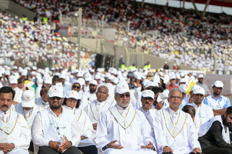 Eucharistic ministers for the early morning Papal mass at Bahrain National Stadium, Bahrain. Khushnum Bhandari / The National

