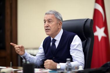 Turkish National Defence Minister Hulusi Akar leads a teleconference meeting in Ankara in October. AFP
