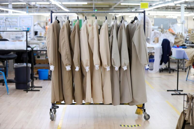Completed protective gowns for workers in the U.K. National Health Service (NHS) hang on a rail at the Burberry Group Plc factory in Castleford, U.K., on Tuesday, April 21, 2020. The U.K. ran the risks running out of protective equipment for its hospital staff as half the doctors working in high-risk areas reported supply shortages in an April survey by the British Medical Association. Photographer: Chris Ratcliffe/Bloomberg