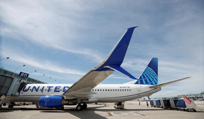 FILE PHOTO: United Airlines first new livery Boeing 737-800 sits at a gate after arriving at O'Hare International Airport in Chicago, Illinois, U.S., June 5, 2019. REUTERS/Kamil Krzaczynski/File Photo  GLOBAL BUSINESS WEEK AHEAD