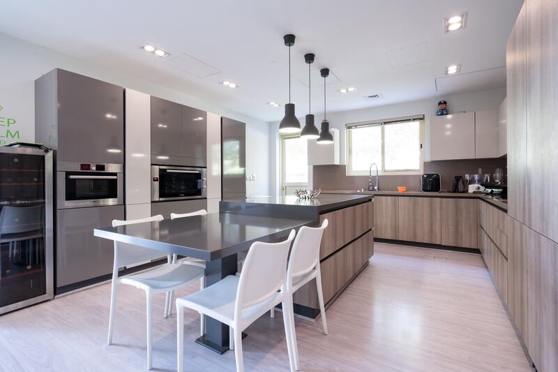 The kitchen includes space to dine.