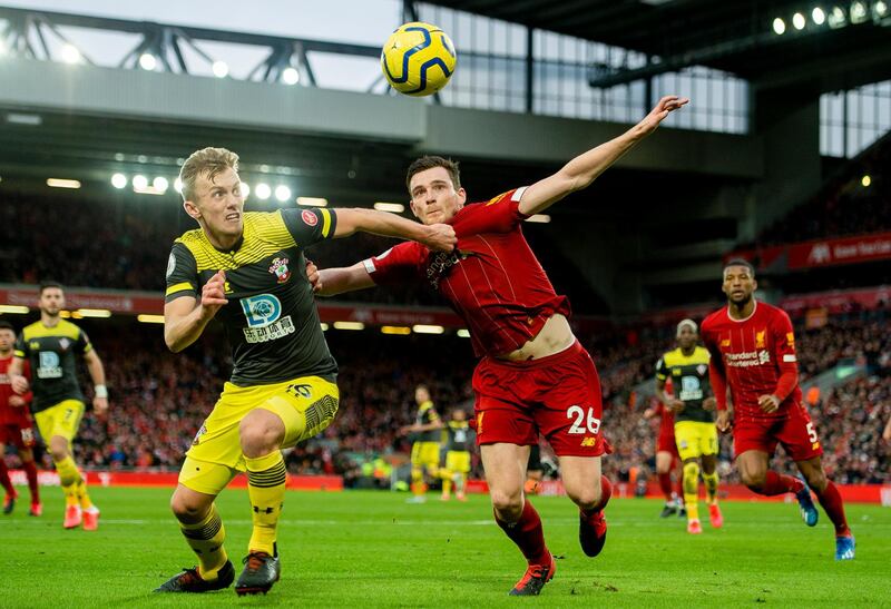 Southampton's James Ward-Prowse, left, vies for the ball with Liverpool's Andy Robertson. EPA