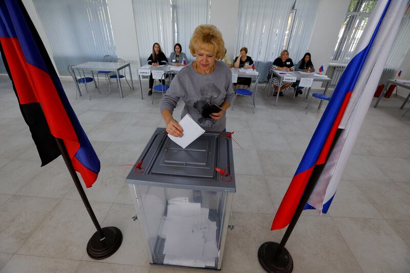 A voter casts a ballot at a polling station during local elections held in Donetsk, Russian-controlled Ukraine. Reuters