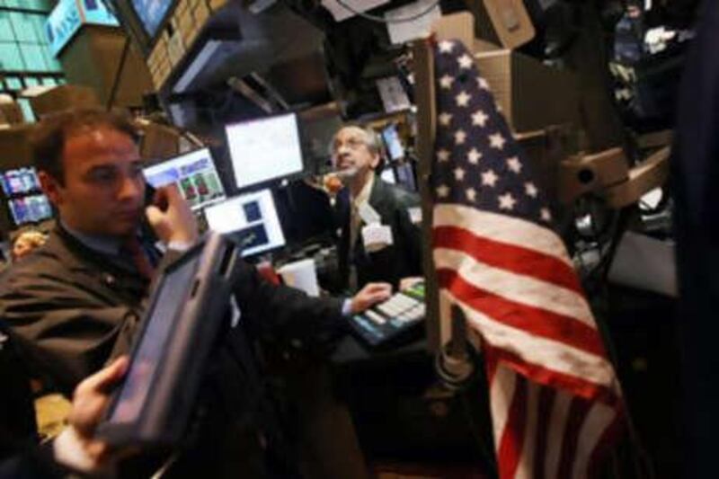 Traders work on the floor of the New York Stock Exchange. Wall Street endured heavy losses yesterday amid sustained worries over the financial health of two big mortgage-financing firms and lingering concerns about corporate earnings, traders said.