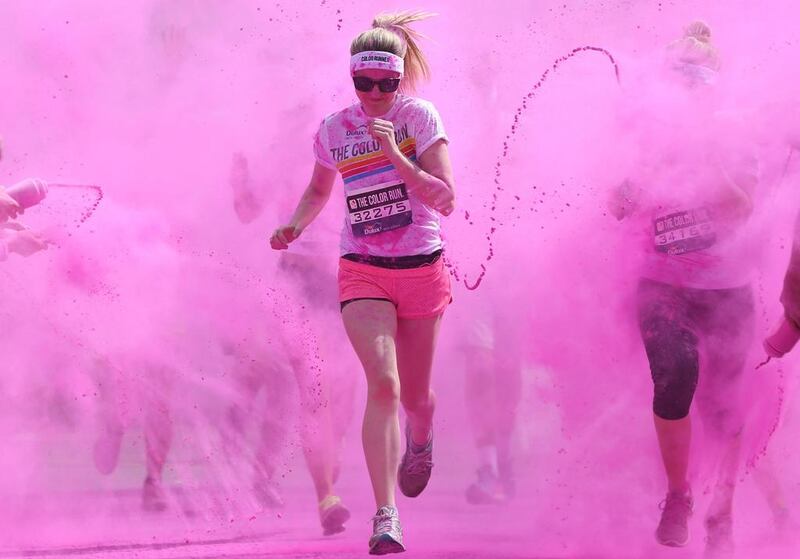 Participants are covered in paint as they take part in the Color Run in London. Neil Hall / Reuters