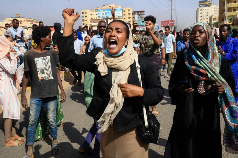 Sudanese protesters hold a rally in Khartoum against overnight detentions by the army of government members. The detentions follows weeks of tensions between military and civilian figures who have shared power since the fall of former president Omar Al Bashir.