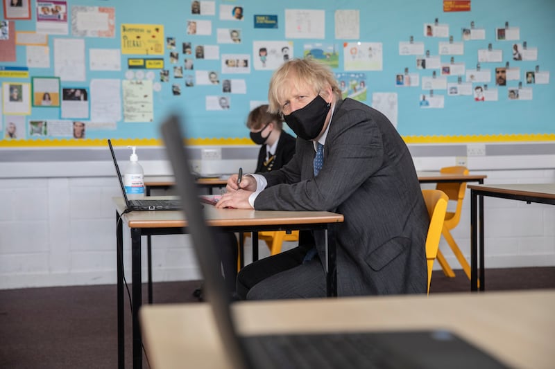 The prime minister visits Sedgehill School in south-east London and takes part in an online class on February 23, ahead of students returning to classrooms after remote learning.