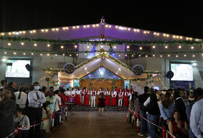 People during the Christmas midnight mass held at St Mary's Catholic Church in Dubai. Pawan Singh / The National