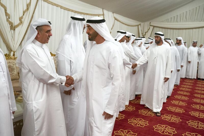 ABU DHABI, UNITED ARAB EMIRATES - September 25, 2019: HH Sheikh Mohamed bin Zayed Al Nahyan, Crown Prince of Abu Dhabi and Deputy Supreme Commander of the UAE Armed Forces (2nd L), offers condolences to the family of HE Abdullah Al Sayyed Al Hashemi. Seen with HE Mohamed Mubarak Al Mazrouei, Undersecretary of the Crown Prince Court of Abu Dhabi (back R).

( Hamad Al Kaabi  / Ministry of Presidential Affairs )
---