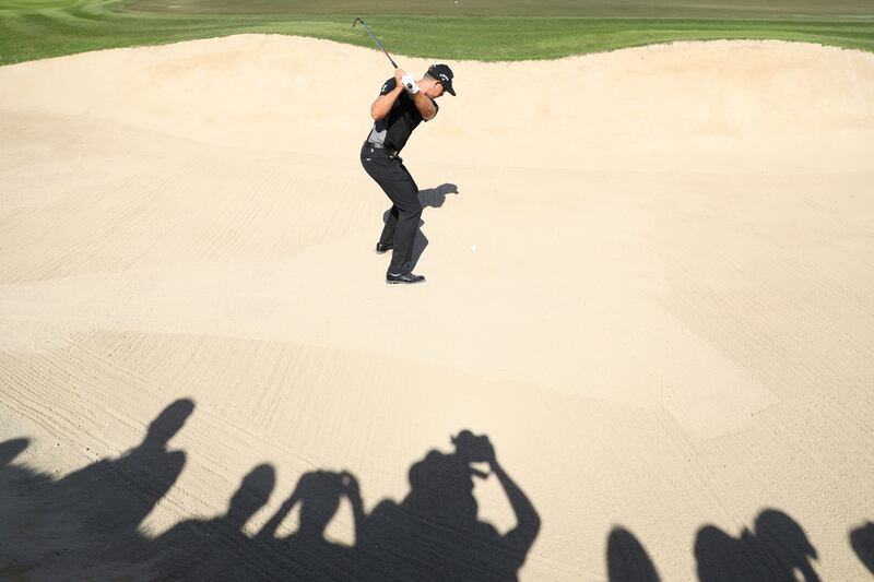 Henrik Stenson hits from a bunker on the 10th hole during the final round of the Omega Dubai Desert Classic. Warren Little / Getty Images