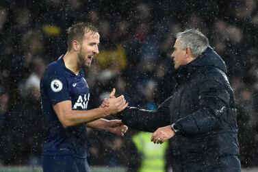 Tottenham manager Jose Mourinho, right, celebrates with Harry Kane. AP