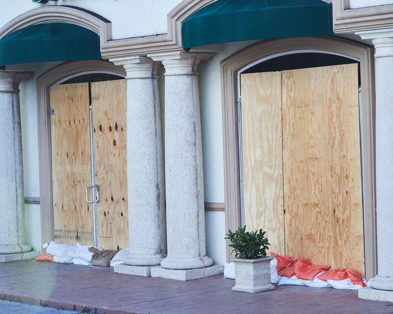 Sandbags sit outside of local businesses in Melbourne, Florida. Zack Wittman / Bloomberg