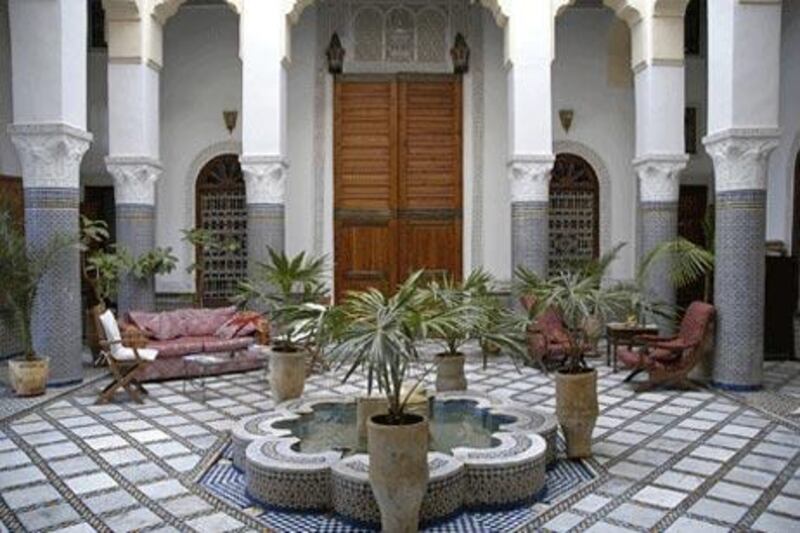 The classic courtyard is almost always symmetrical in design, with distinctive features such as a central fountain and elaborate tiles.