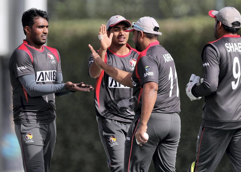 Dubai, United Arab Emirates - January 26, 2019: Amir Hayat (L) of the UAE takes the wicket of Binod Bhandari of Nepal in the the match between the UAE and Nepal in a one day internationl. Saturday, January 26th, 2019 at ICC, Dubai. Chris Whiteoak/The National